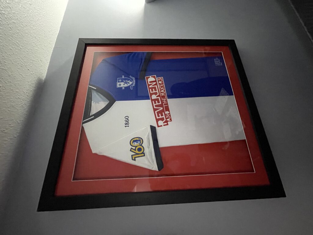 A framed Hallam FC shirt from their 160th year anniversary.
